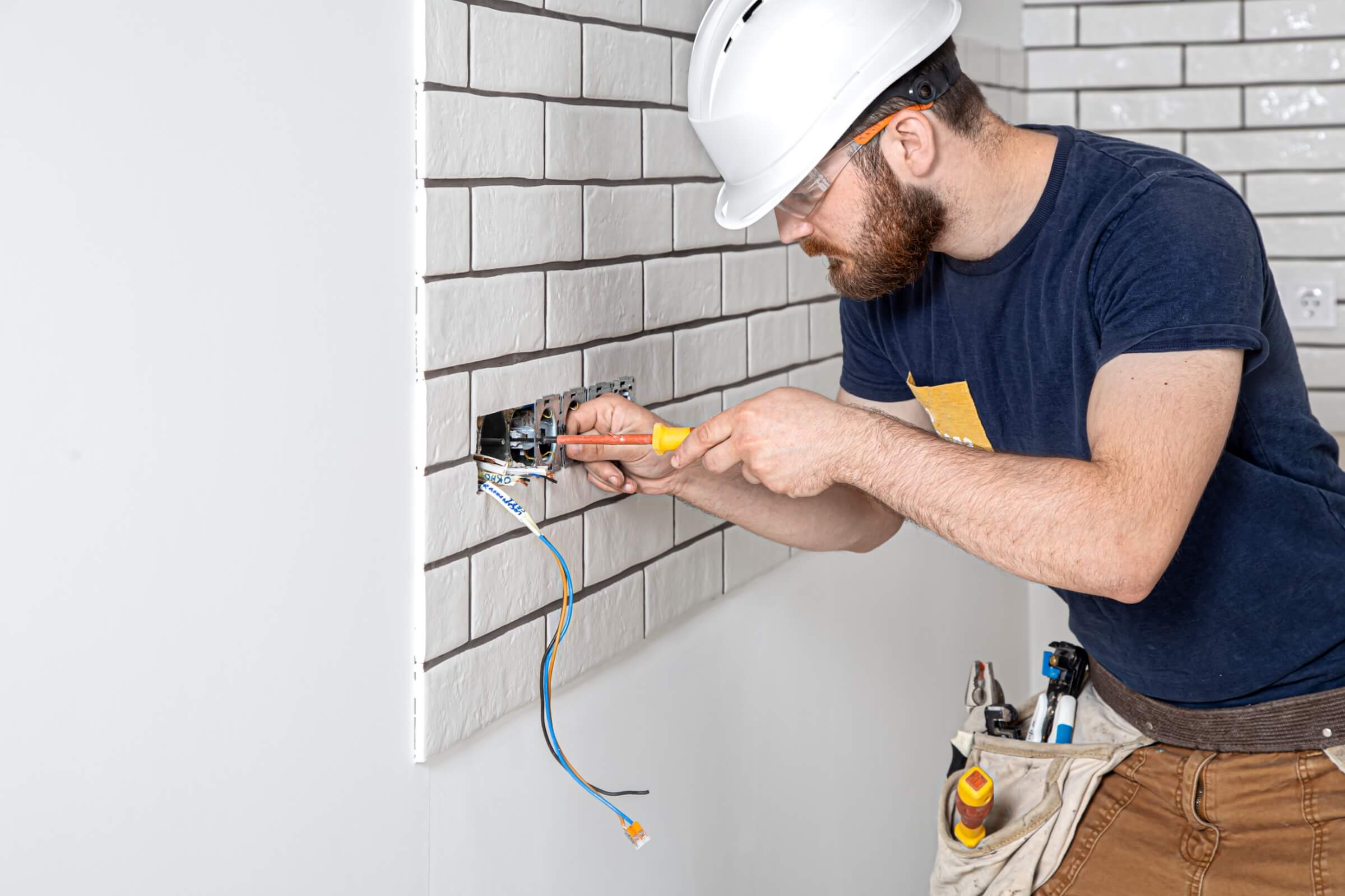 Electrician checking power points