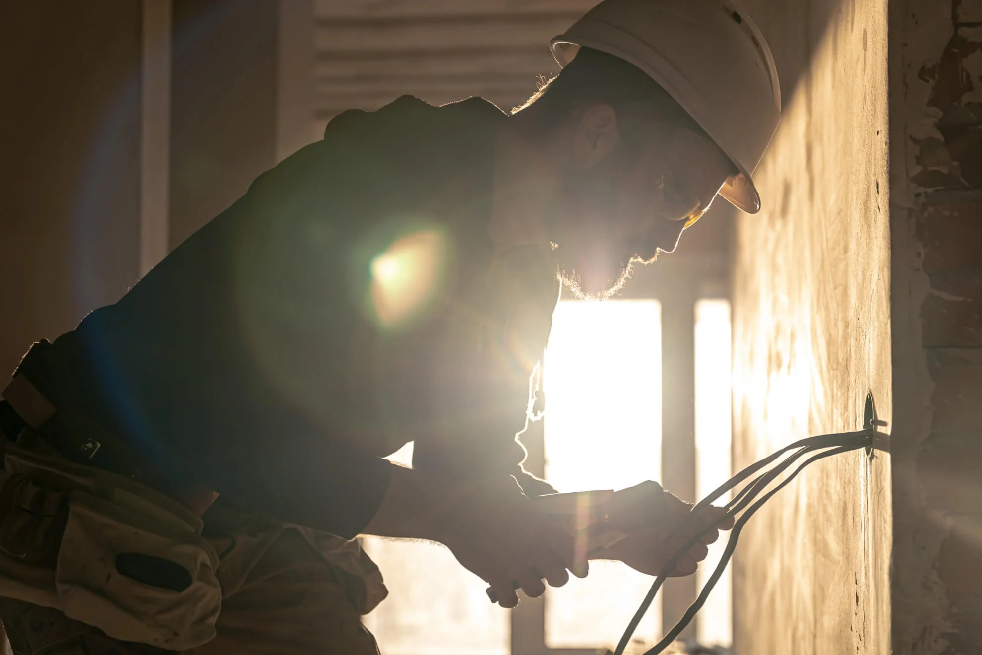 Electrician installing cables