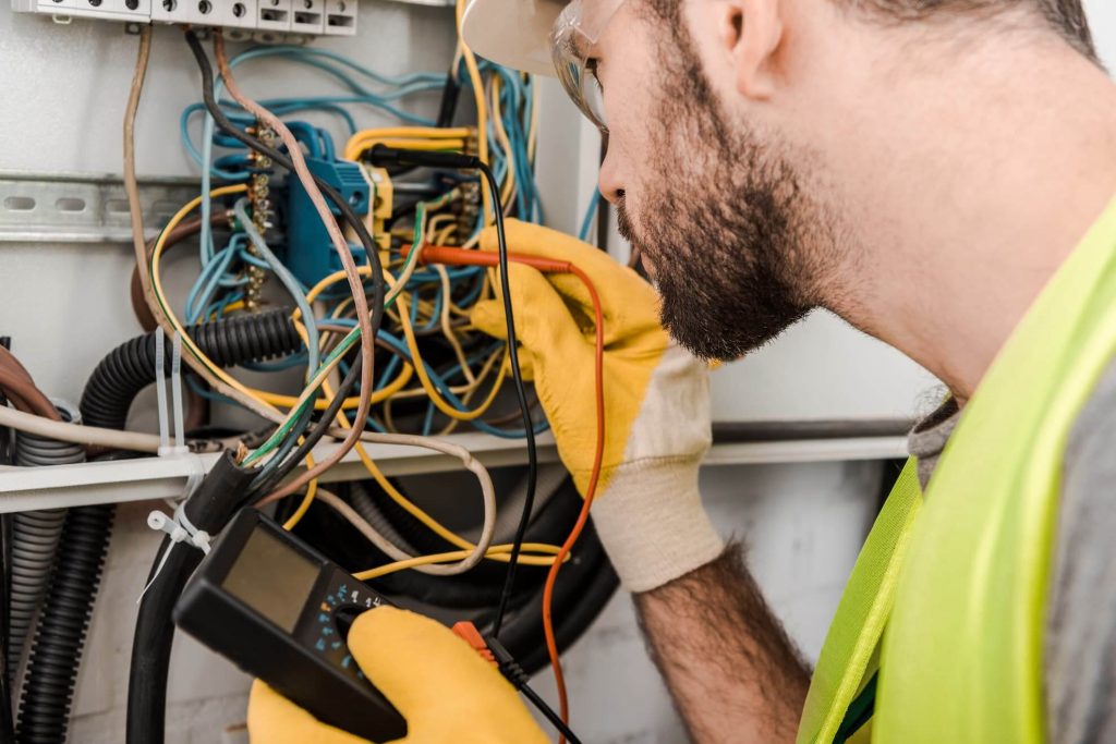 fault finding electrician checking switchboard wiring